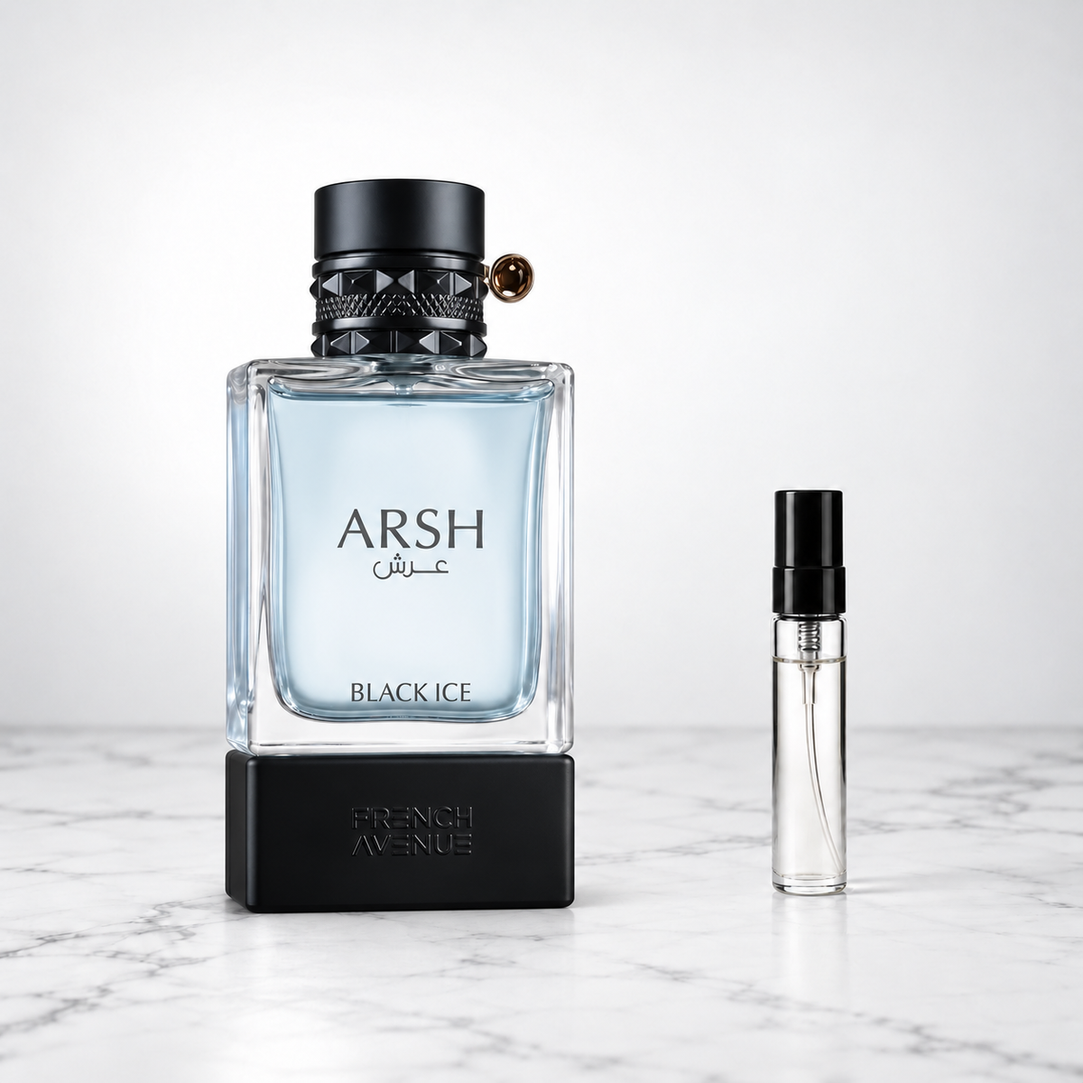 Arsh Black Ice by French Avenue perfume bottle beside a sample decant on white marble