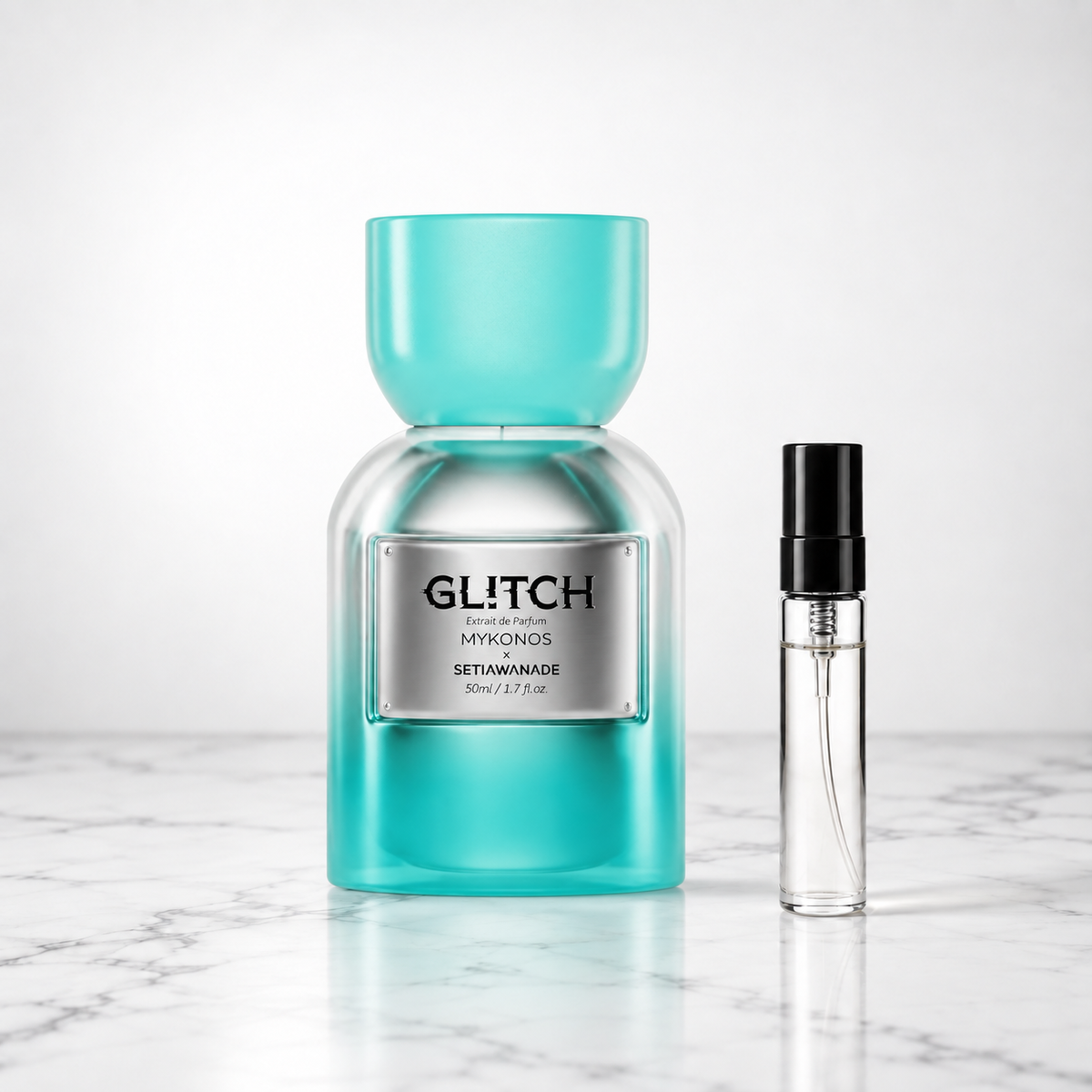 Glitch by Mykonos bottle beside a perfume sample decant on marble
