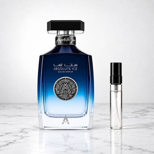 absolute ice perfume bottle beside a 5ml decant on white marble