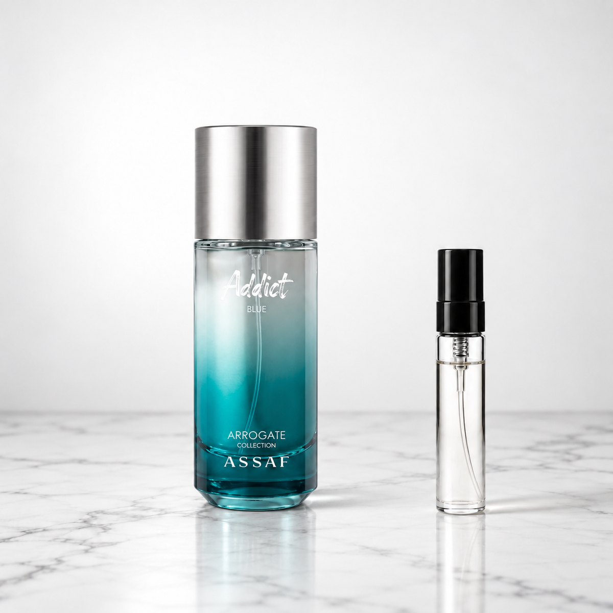 Addict Blue by Assaf perfume bottle with sample decant on white marble