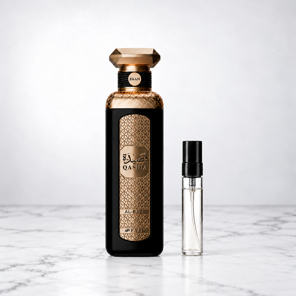 Qasida Al-Badr by FAAN perfume bottle beside a capped sample decant on white marble
