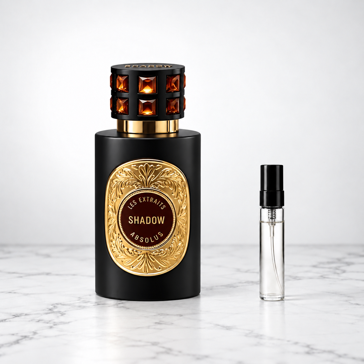 Shadow by French Avenue perfume bottle beside a sample decant on white marble
