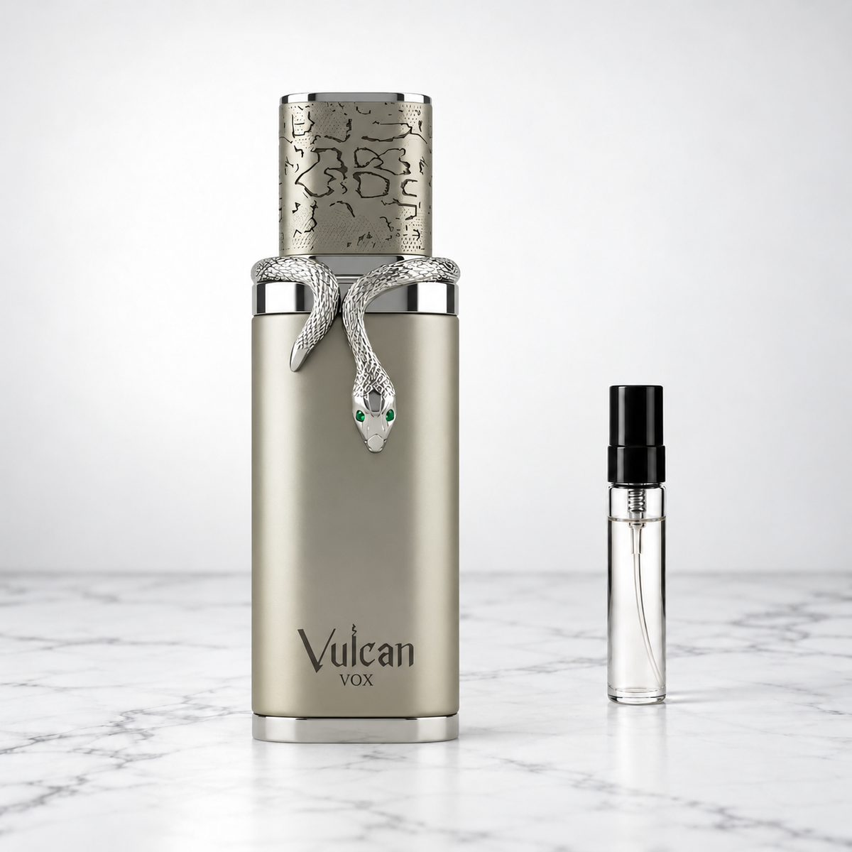 Vulcan Vox by French Avenue perfume bottle beside a sample decant on white marble