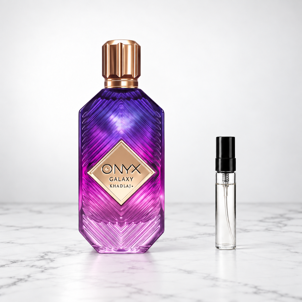 Onyx Galaxy by Khadlaj perfume bottle beside a sample decant on white marble
