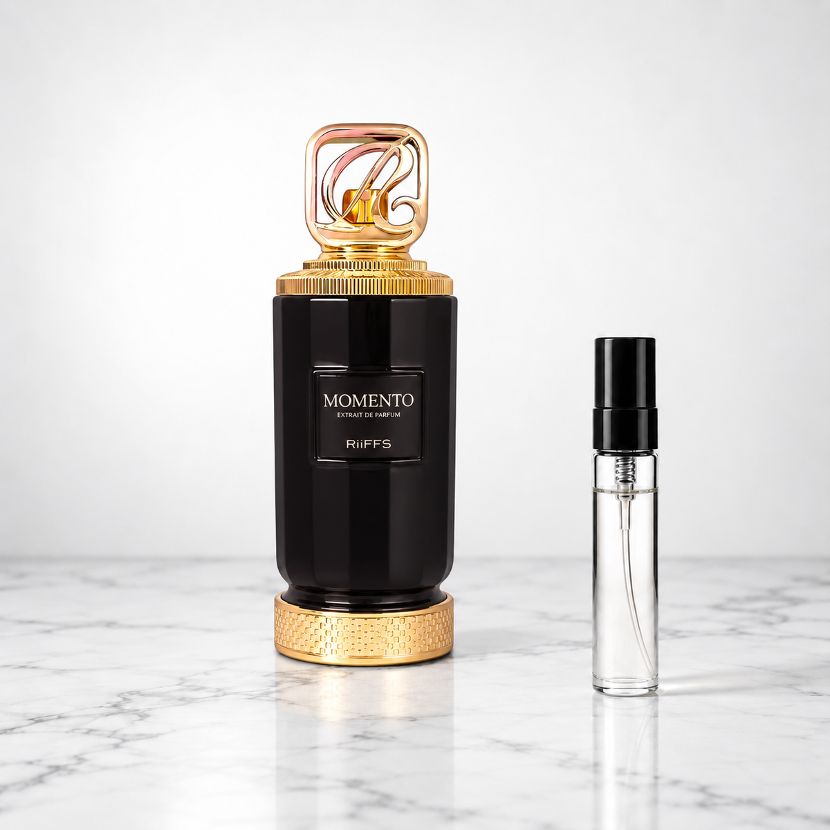 momento perfume bottle with sample decant on marble
