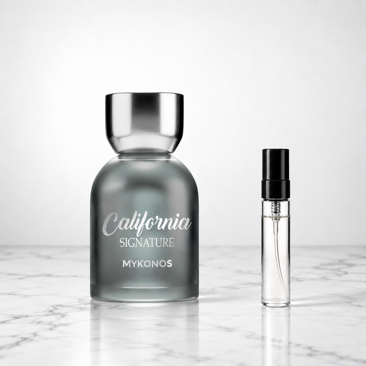 California Signature by Mykonos bottle beside a perfume sample decant on marble