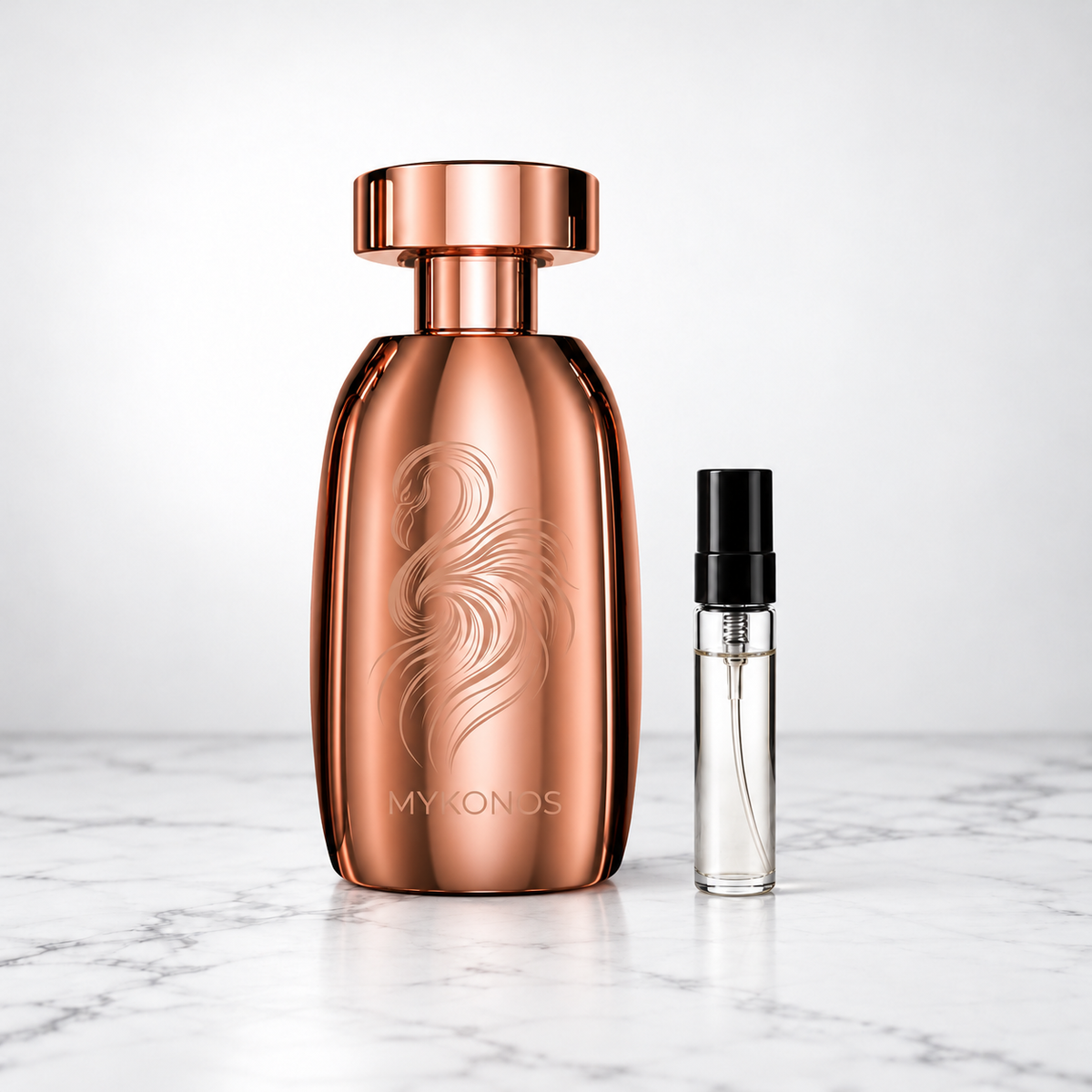 Marbella by Mykonos copper perfume bottle beside a capped sample decant on white marble