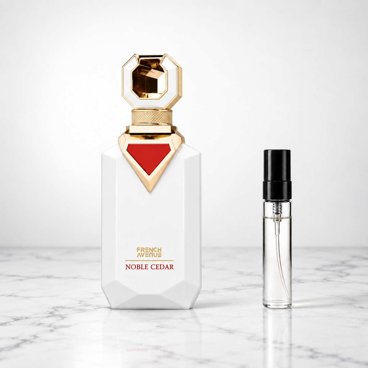 noble cedar perfume bottle beside a 5ml decant on white marble