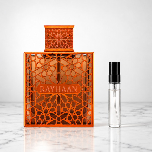 Vantage by Rayhaan perfume bottle with sample decant on white marble